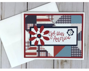 A patriotic God Bless America greeting card with patchwork quilt design and red, white and blue flowers.