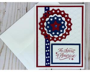 A patriotic 4th of July card with embossed cardstock, a blue ribbon with stars, handmade embellishment and a Spirit of America sentiment.