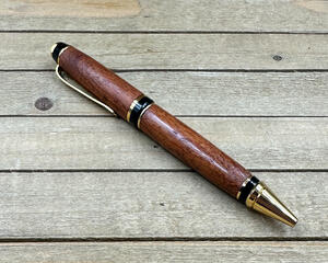 Gold plated pen with wood accents 