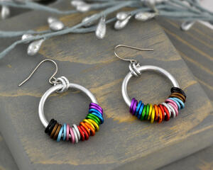 Progress pride chainmaille hoop earrings with 22 tiny links; two links in each of the 11 colors of the rainbow progress pride flag