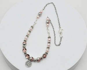 18.5-inch necklace featuring lampwork beads, Swarovski pearls, and a stainless steel pendant, set on a steel chain with silver-toned accents