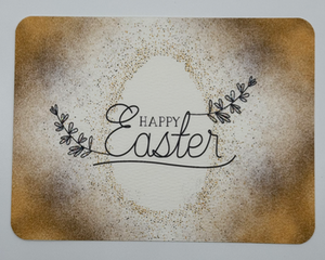 Gold Easter egg splattered paint with the sentiment Happy Easter accented with glitter sprigs 