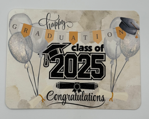 Cream watercolor background graduation card with black graduation cap with gold tassel, cream balloons highlighted in shimmery paints 