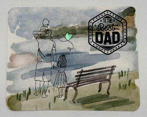 Watercolor Father’s Day card featuring dad with 2 children by the lake , one holding a balloon 