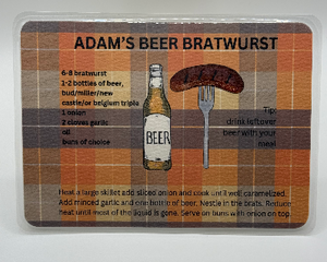 Laminated recipe card, orange and brown background with bratwurst and beer bottle