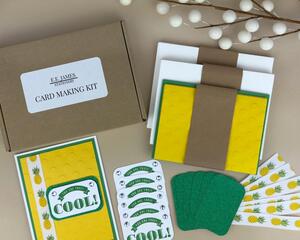 A pineapple card kit to make 6 cards with cardstock, stamped sentiments, ribbons and cards and envelopes.