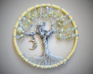 This is the front view of a yellow tree of life. The branches are delicately adorned with various yellow beads. compact in size, at 3inches