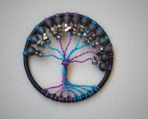 a perfect blend of coloring creates this magical tree, black, purple, blue, multicolor chips