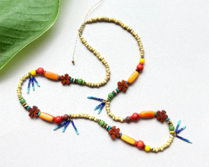 Fun, colorful, casual beaded necklace with a tropical vibe and made with eco-friendly materials. Adjustable length 24" to 28".