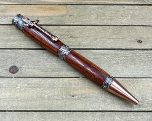 Exotic hardwood cowboy themed pen in antique copper 