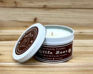 Cool mint and creamy vanilla scented soy candle in 6oz tin with lid off.