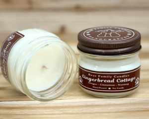 Gingerbread scented soy candle in 4oz jar. One jar standing up with lid on and one jar on its side with lid off.
