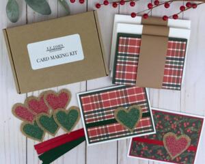 A handmade Christmas card making kit with winterberries and plaid scrapbook paper, cardstock, embellishments and envelopes to make 6 cards.