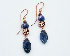 Handmade earrings with faceted sodalite beads and copper wire spirals, 2.5 inches long, ocean-inspired boho jewelry.