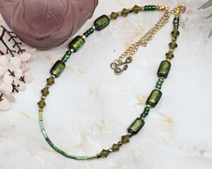 An 18-inch handmade necklace with vintage olive-green glass beads, bicones, and seed beads on a gold-plated stainless steel chain