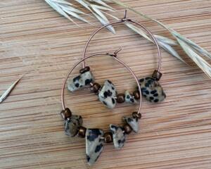 These are beautiful Dalmatian chips  made in to hoop earr