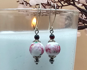 Vintage-style earrings with pink floral lampwork glass beads and silver hooks
