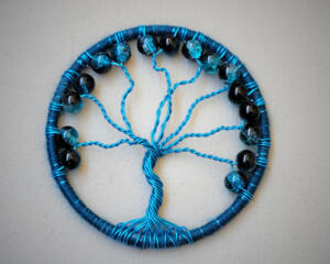 Handmade vibrant lue Tree of Life home decor with crackle glass beads, wire branches, and a yarn-wrapped hoop.