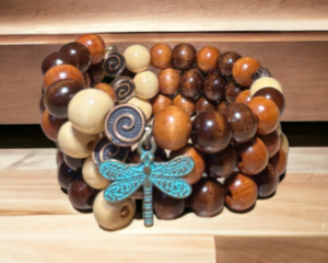Wood memory wire bracelet with three tiers, with dragon fly charm.