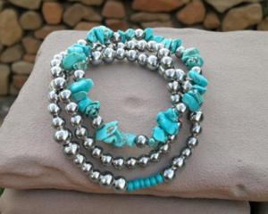 Beautiful turqoise blue and silver plated set of three bracelets.