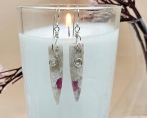 Handmade earrings with opal and quartz stones featuring wire spiral details.