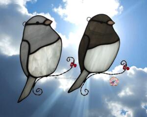 Junco Suncatchers in direct sunlight- light gray and dark gray glass with white glass Juncos.
