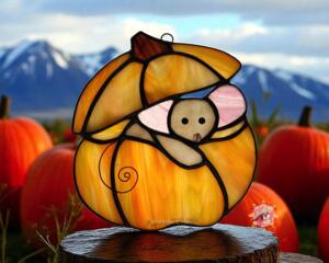 Halloween Mouse Suncatcher made of orange, light brown, light pink and brown glass.