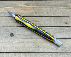 Black and yellow wood handled craft knife