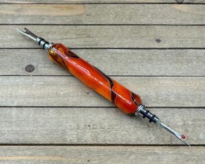 Orange and black resin double ended seam ripper