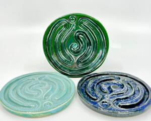 Set of three handmade ceramic finger labyrinths in (L to R) aqua, green, and royal blue glazes, made for meditation and stress relief.