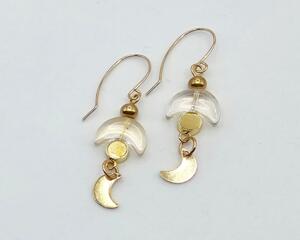 Handmade celestial earrings with glass crescent beads and gold moon dangles on 14k gold-filled wires.