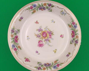 A pretty china dish for holding your jewelry.