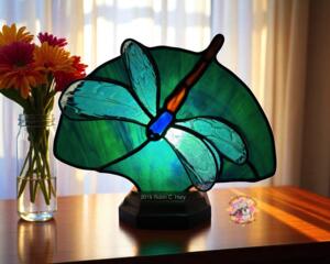 Dragonfly Stained Glass Fan Lamp by Robin C. Hary shown with white wings and green background.