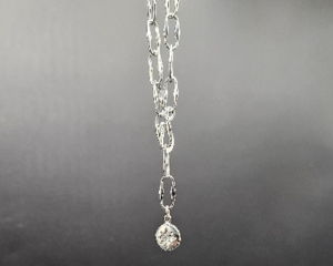 Handmade necklace with silver plated pendant set with North Star cubic zirconia on rhodium chain and hook front clasp.