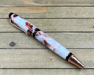 White and copper resin swirled cigar style ballpoint pen