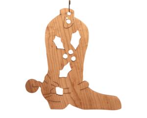 Handmade wooden Christmas tree ornament shaped like a cowboy boot, featuring a sprig of holly On the side of the boot, and round berry accents.