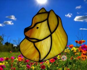 Pomeranian stained glass ornament shown in light red/orange glass.