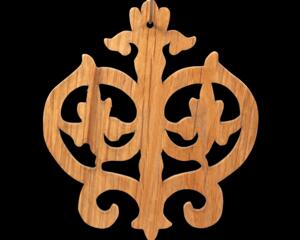 Intricate Victorian-style fretwork Christmas tree ornament handcrafted from natural hardwood with visible wood grain, showcasing symmetrical curls, loops, and ornate cut-out designs.