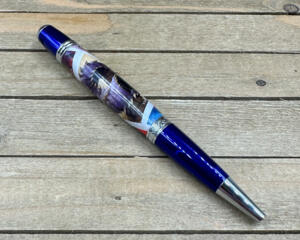 Blue and chrome pen woth DnD postage stamps cast in clear resin 