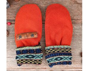 Handmade orange fleece baby mittens with patterned cuffs, made from soft fleece; cozy thumbless winter mittens for infants & toddlers.