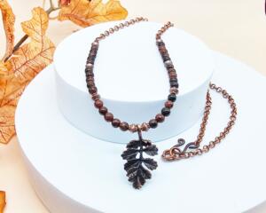 handmade 23 inch necklace featuring copper leaf pendant, 4mm round mahogany obsidian and copper accent beads on copper rollo chain.