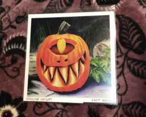 a 5 inch by 5 inch print on photo paper of a watercolor and micron pen painting of a grinning cyclopes jack o lantern. 