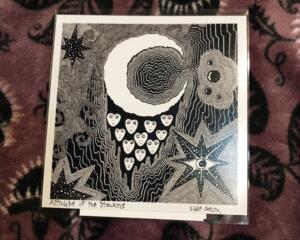 a 5 inch by 5 inch photo paper print of a micron pen drawing of a moon dripping faces before a psychedelic sky scape.