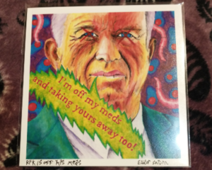 a print of RFK jr with his eyes crossed out saying "i'm off my meds and taking yours away too" while worms & amoebas dance in the background