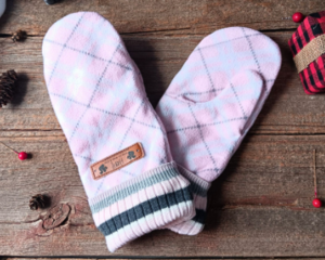 A cozy pair of teen, small woman’s handmade mittens crafted from soft pink argyle pattern fleece with ribbed cuffs; handmade & winter ready.