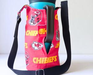 Handmade Kansas City Chiefs water bottle bag holds tumblers from 20 oz to 64 ounces securely, shown here with handle through the side snap.