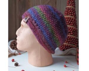 A hand knit wool blend beanie in deep plum, berry, & green stripes. Ideal for adults & teens, it is crafted from soft Turkish yarns.