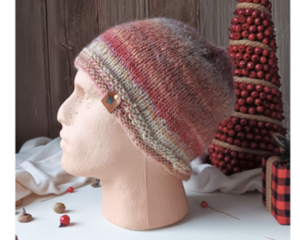 A hand knit wool blend beanie in rustic red and brown stripes. Ideal for adults & teens, it is crafted from soft Turkish yarns.
