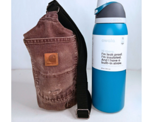 Upcycled Carhartt brown canvas bag with adjustable strap and waterproof lining.