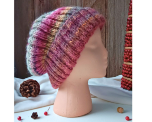 A hand knit wool blend beanie in ombre shades of purple, yellow and green stripes. Ideal for adults and teens, made from soft Turkish yarn.